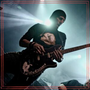 Bill Lonero playing guitar on stage
