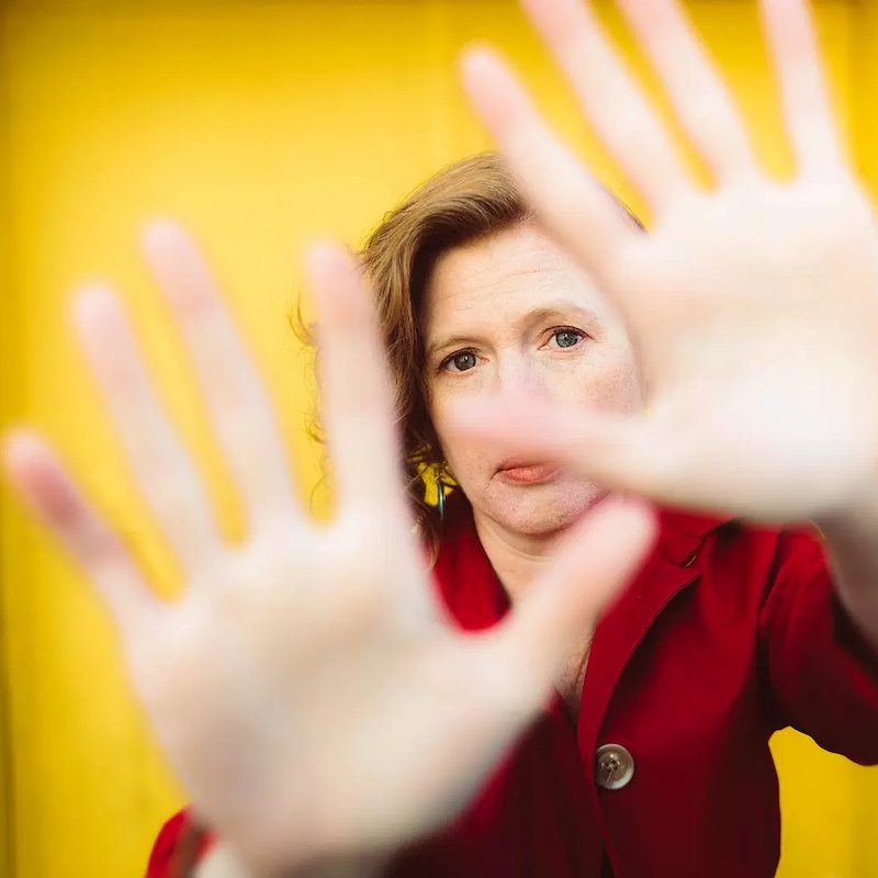 Anna Larson holding out hands, fingers spread