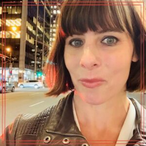 Maggie Steward, Mundial Law headshot outdoors in evening cityscape