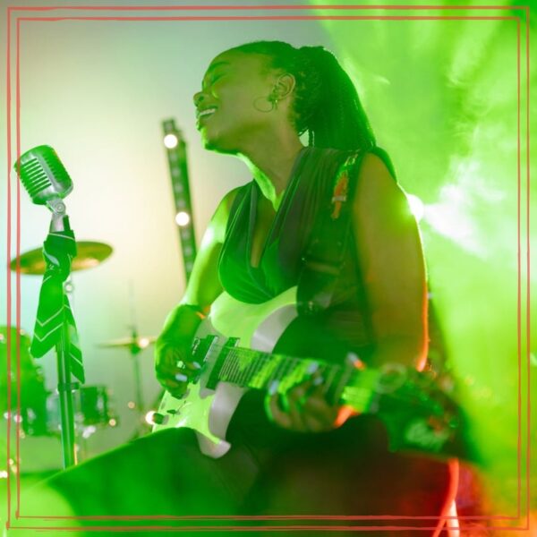 Woman playing guitar while singing | Photo by Yan Krukau https://www.pexels.com/photo/woman-playing-guitar-while-singing-9009535/ | Musical Listening episode artwork for The Unstarving Musician