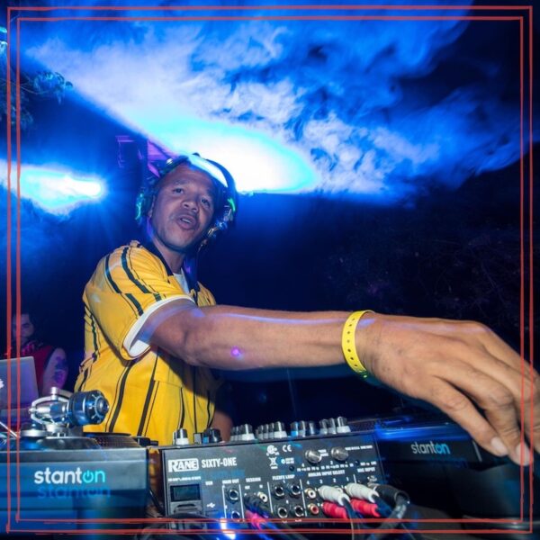 Public Speaker, DJ Amani Roberts at DJ sound console on dark lit background | Episode artwork for The Unstarving Musician