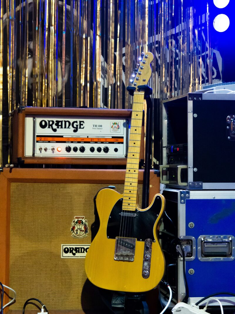 Photo by Sirius Harrison on Unsplash https://unsplash.com/photos/guitar-with-orange-amplifier-on-stage-b6FMS_frWBY Guitar with Orange amplifier on stage