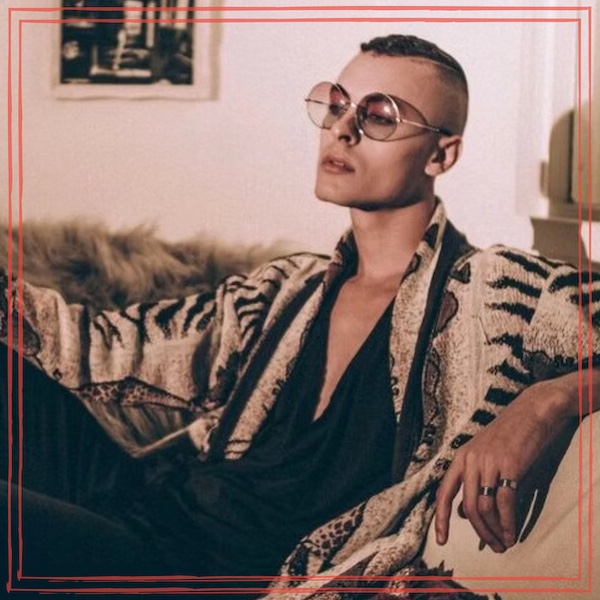 Unstarving Musician episode 350 artwork featuring Cory Wade sitting on sofa wearing tinted glasses