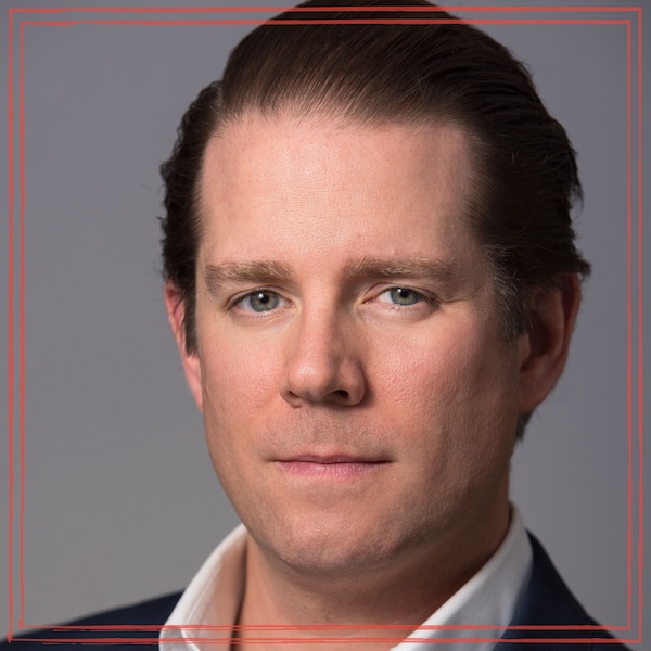 Daniel Scott of Spotlight Advisory group headshot on gray gradient background